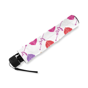 The Fashionable Umbrella features a wind-resistant frame and an automatic open and close mechanism. Its vibrant design and compact size make it easy to carry and stylish in any weather. Design with Multicolor lip prints and the word love between row groupings. Folded and compact umbrella, small enough to fit in your pocket 