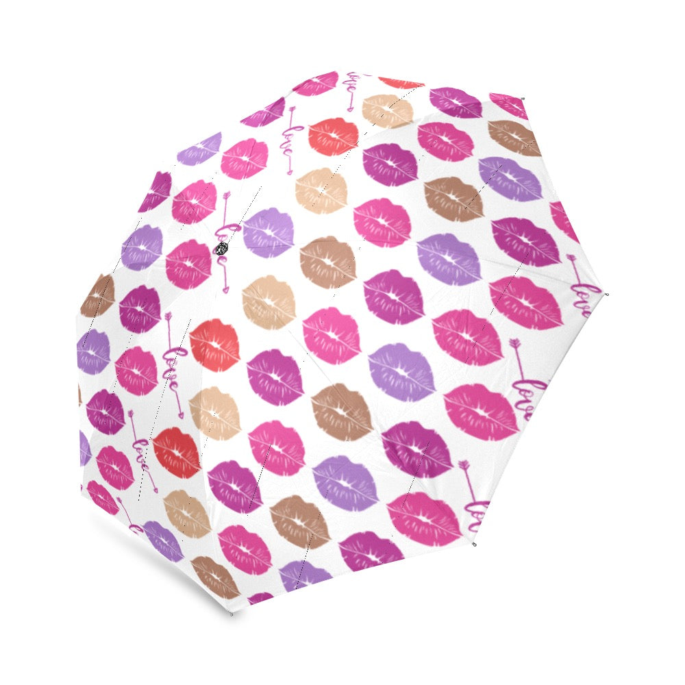 The Fashionable Umbrella features a wind-resistant frame and an automatic open and close mechanism. Its vibrant design and compact size make it easy to carry and stylish in any weather. Design with Multicolor lip prints and the word love between row groupings 