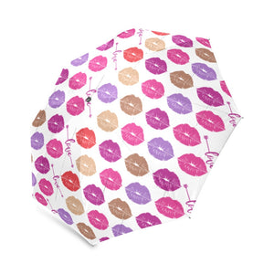 The Fashionable Umbrella features a wind-resistant frame and an automatic open and close mechanism. Its vibrant design and compact size make it easy to carry and stylish in any weather. Design with Multicolor lip prints and the word love between row groupings 