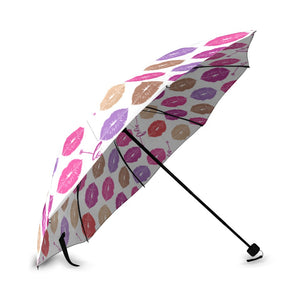 The Fashionable Umbrella features a wind-resistant frame and an automatic open and close mechanism. Its vibrant design and compact size make it easy to carry and stylish in any weather. Design with Multicolor lip prints and the word love between row groupings. Umbrella is open and propped on the handle